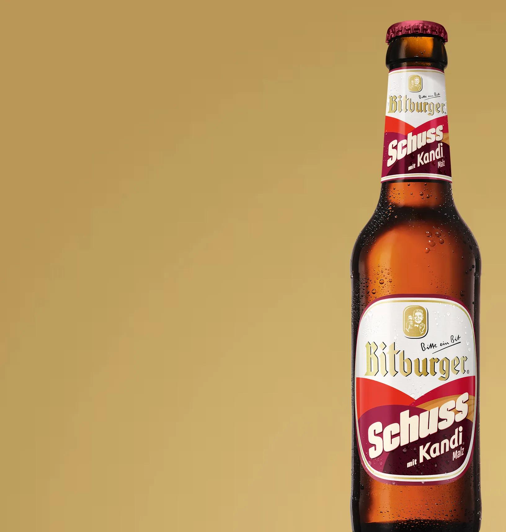 Produktdarstellung "Bitburger Schuss" in einer braunen Flasche.
